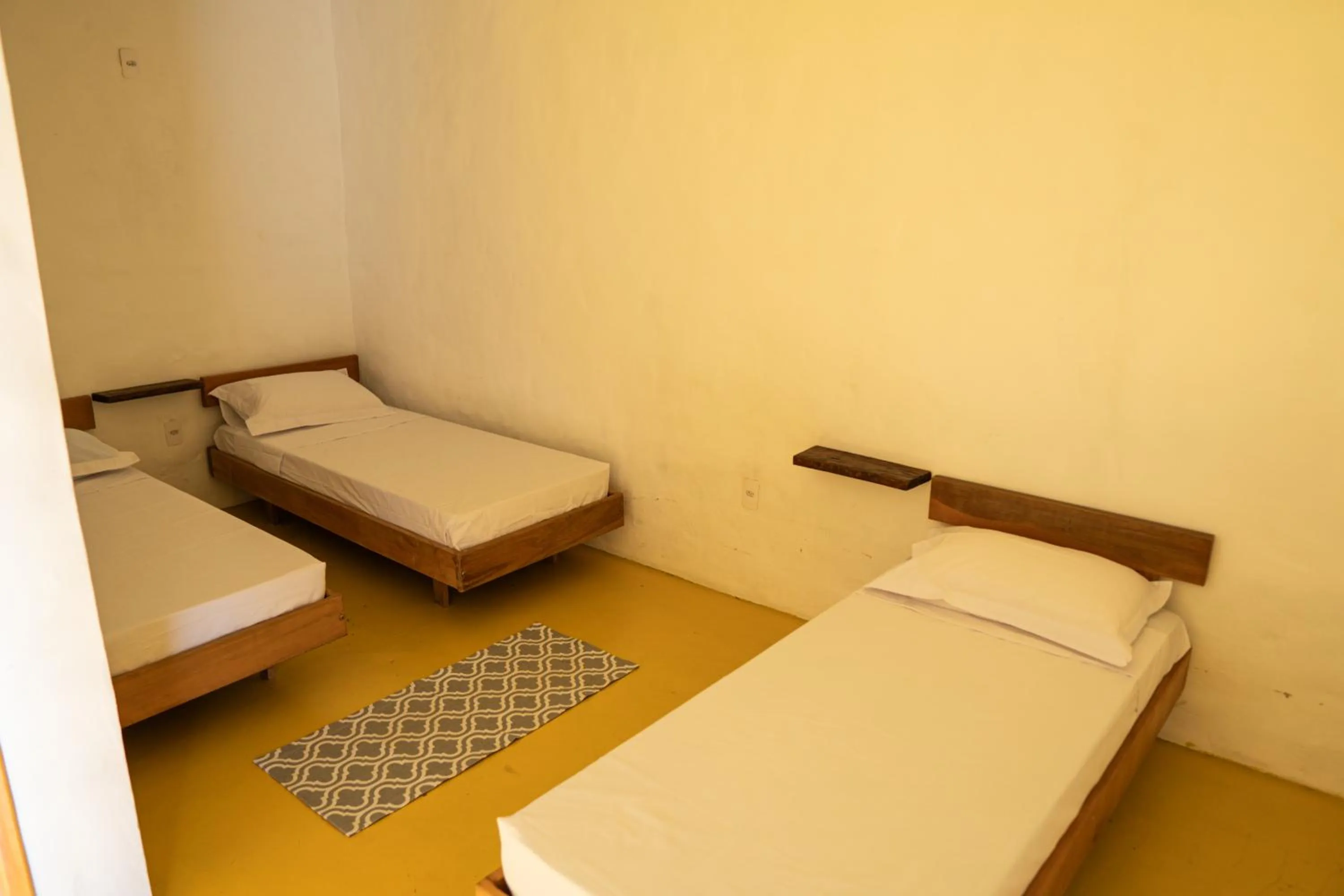 Bed in Pousada Aracuã