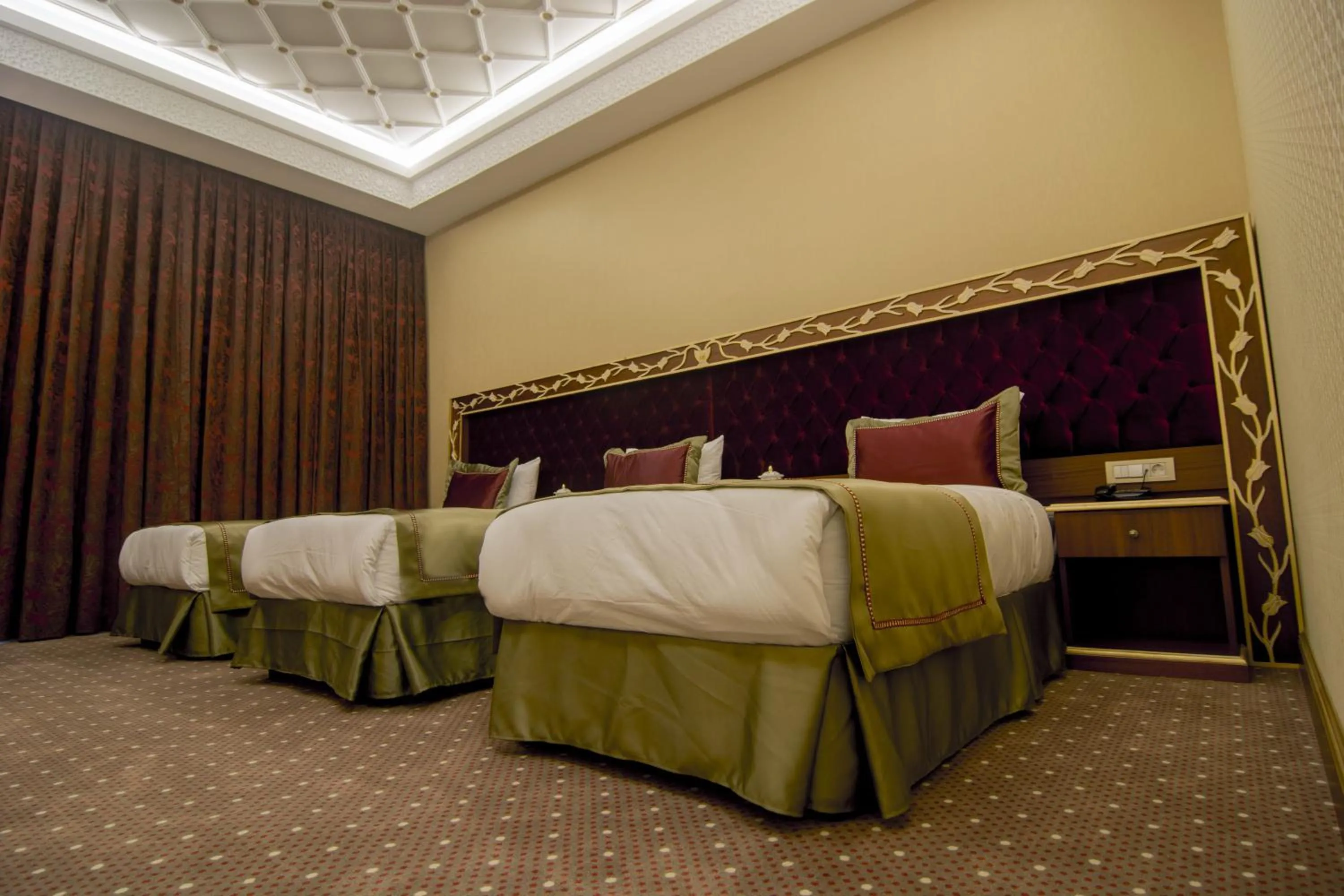 Bed in MB Deluxe Hotel