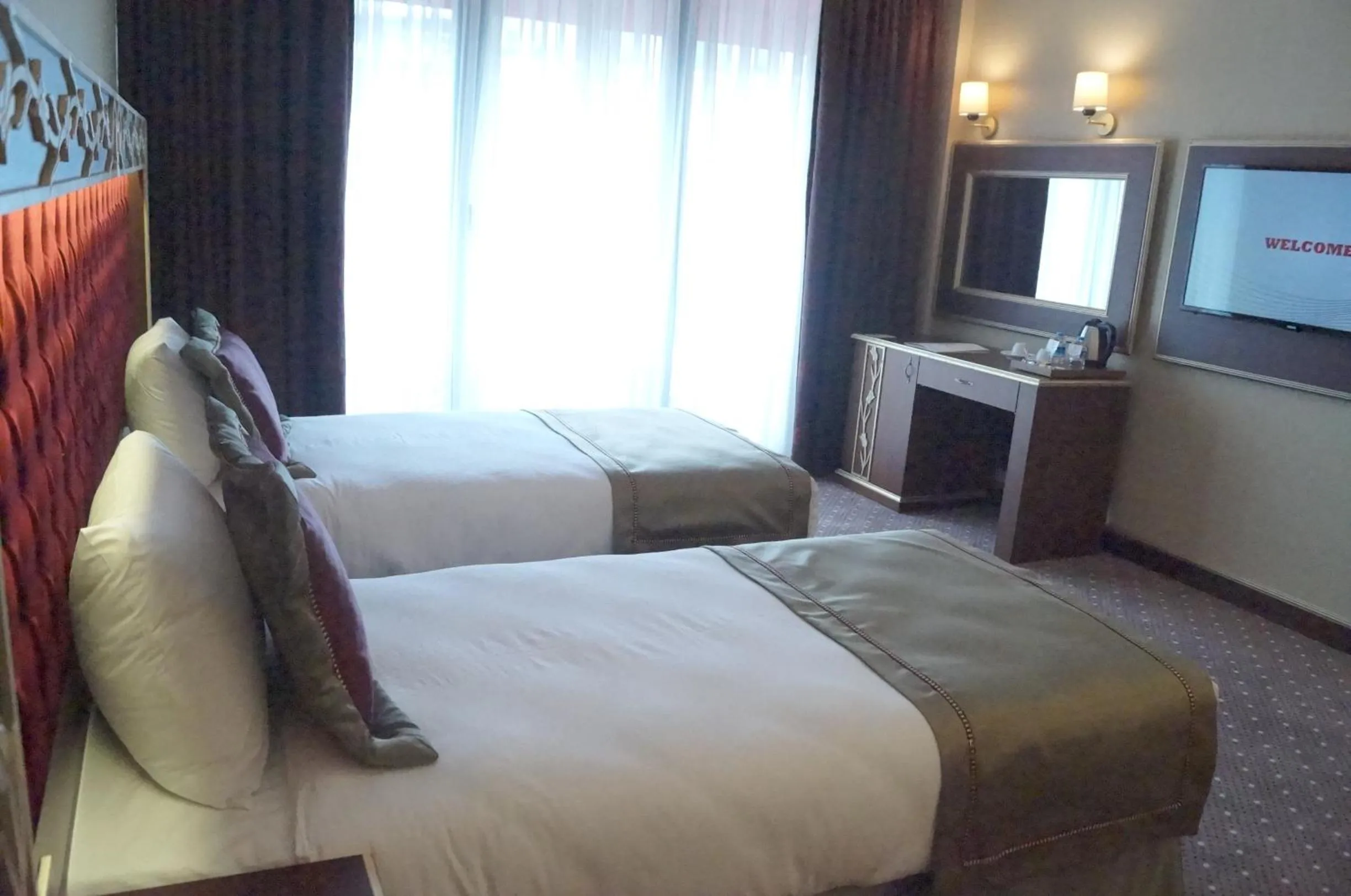 Bed, Room Photo in MB Deluxe Hotel