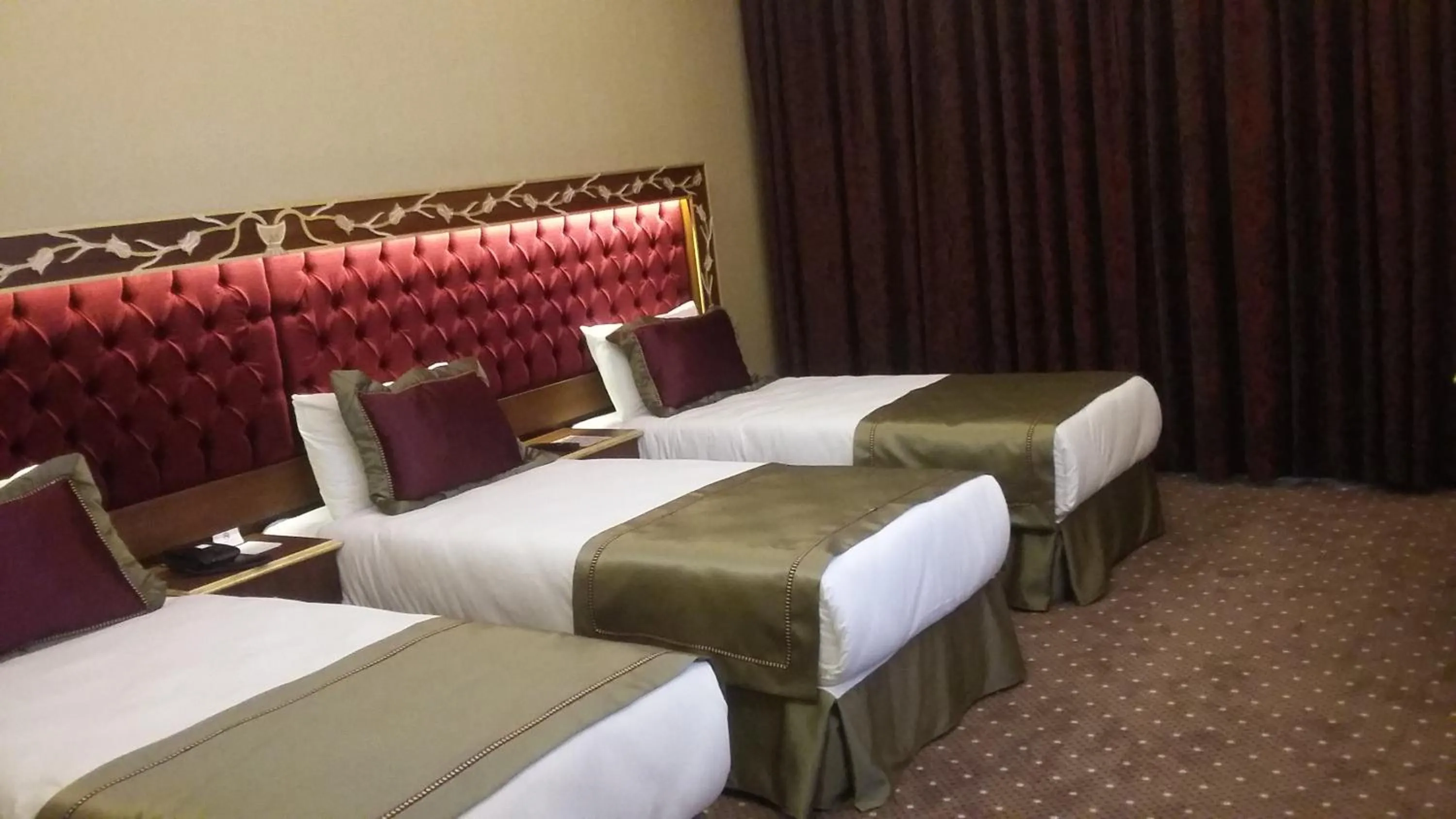 Bed in MB Deluxe Hotel