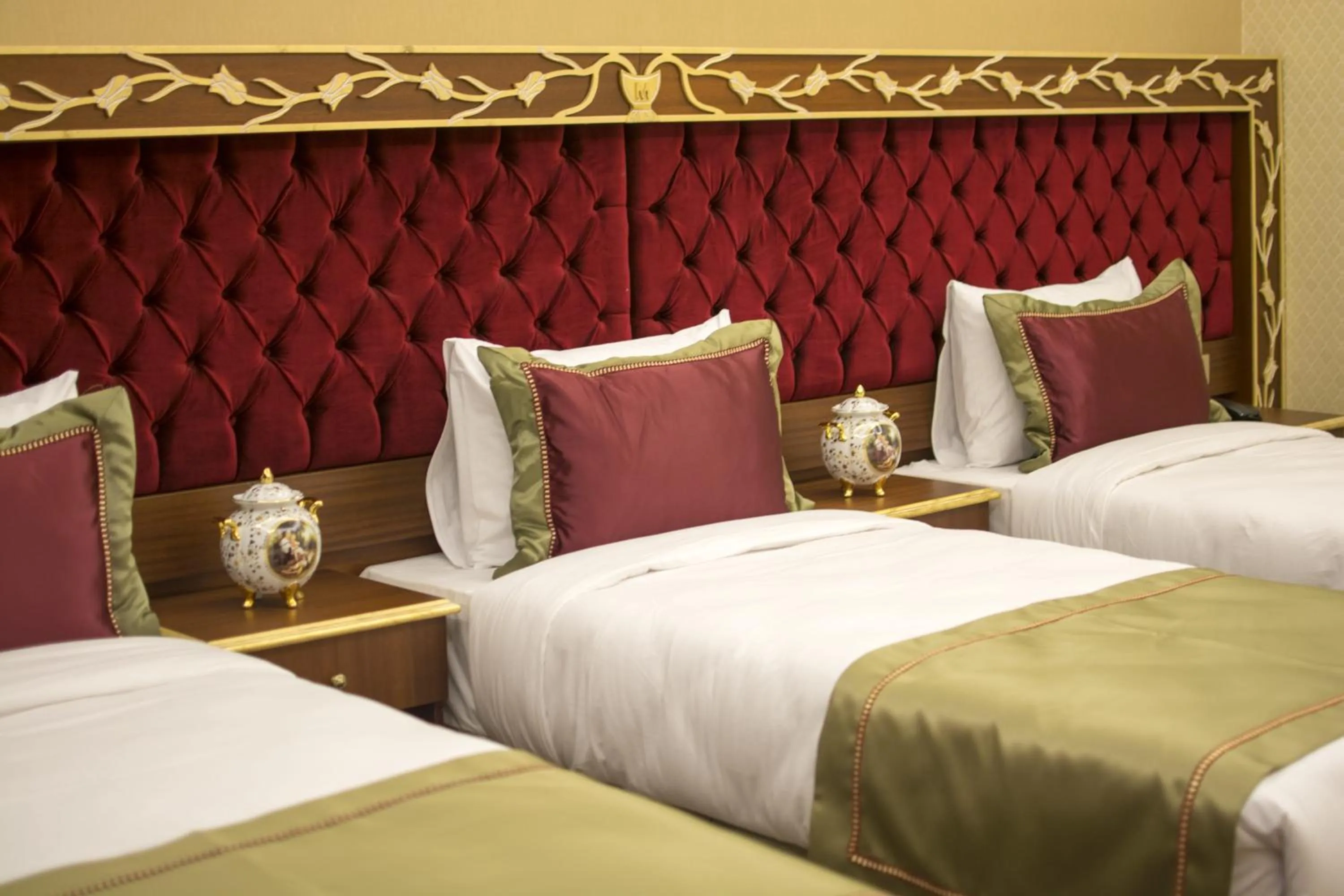 Bed in MB Deluxe Hotel