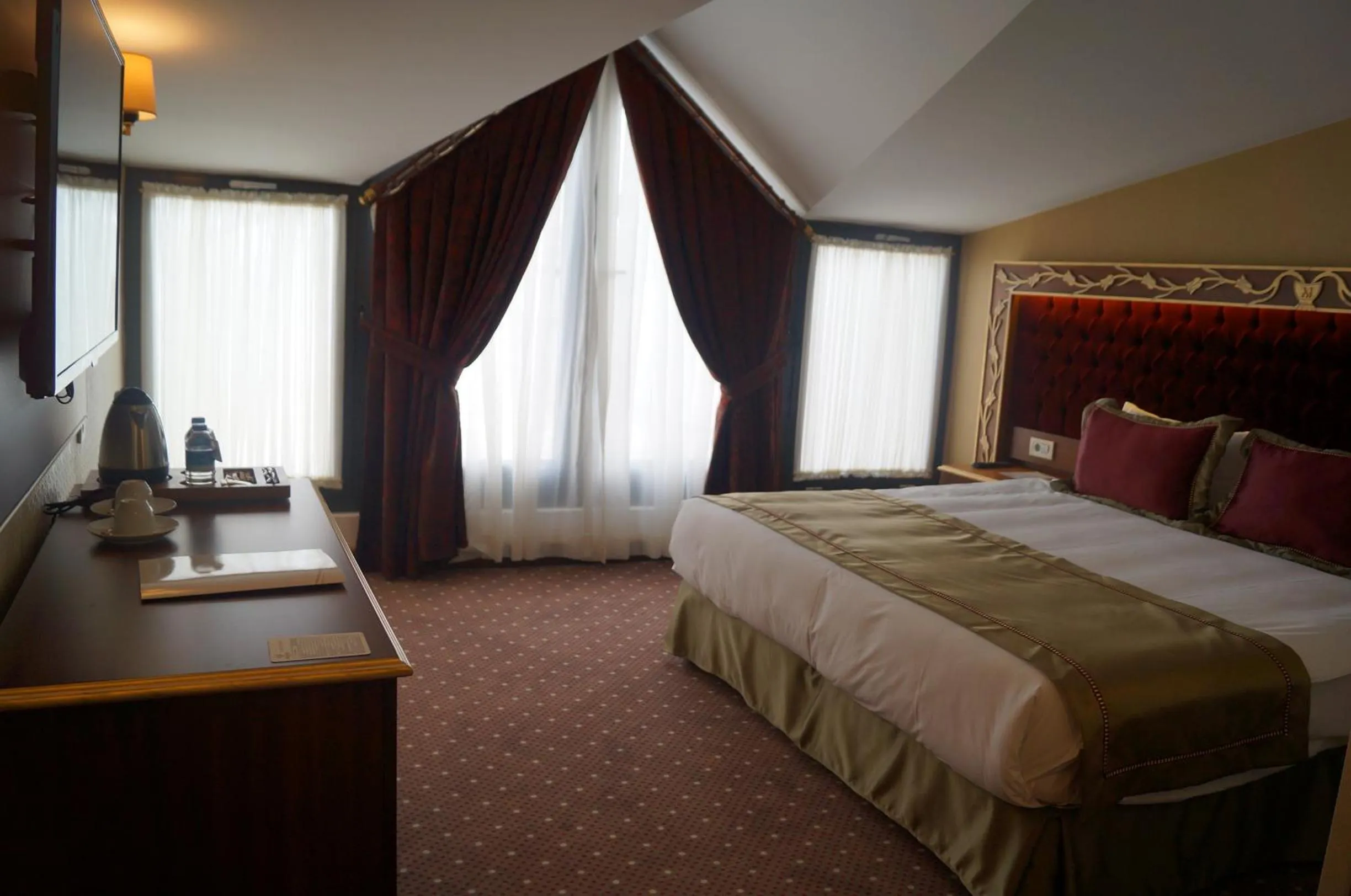 Bed, Room Photo in MB Deluxe Hotel