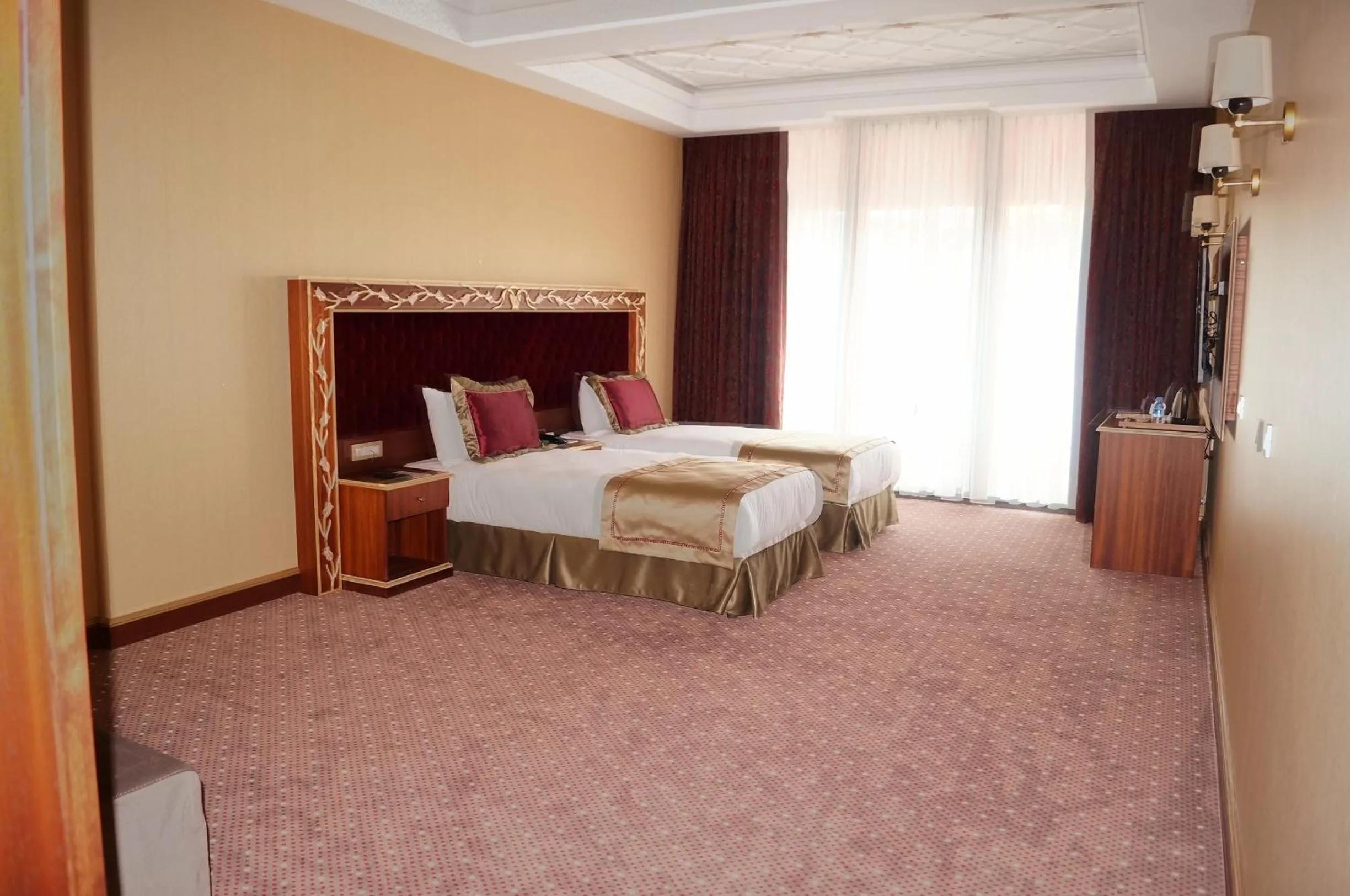 Bed, Room Photo in MB Deluxe Hotel