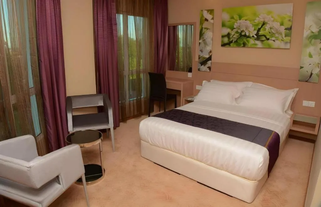 Bed in The Garden Boutique Hotel