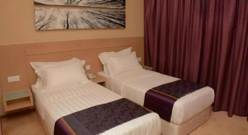 Bed in The Garden Boutique Hotel