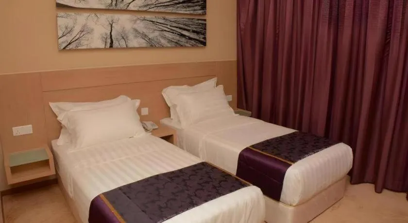 Bed in The Garden Boutique Hotel