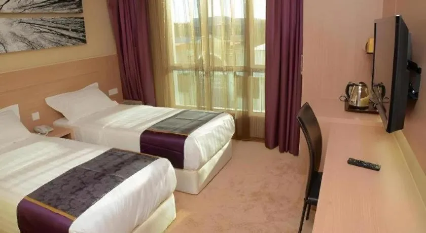 Bed in The Garden Boutique Hotel