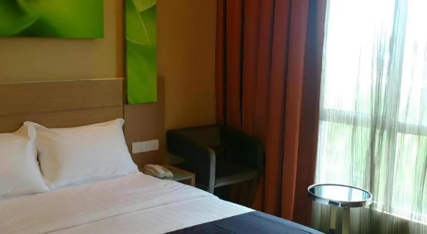 Bed in The Garden Boutique Hotel