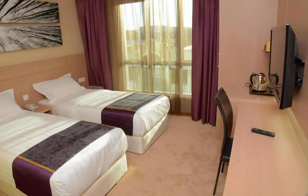 Bed in The Garden Boutique Hotel