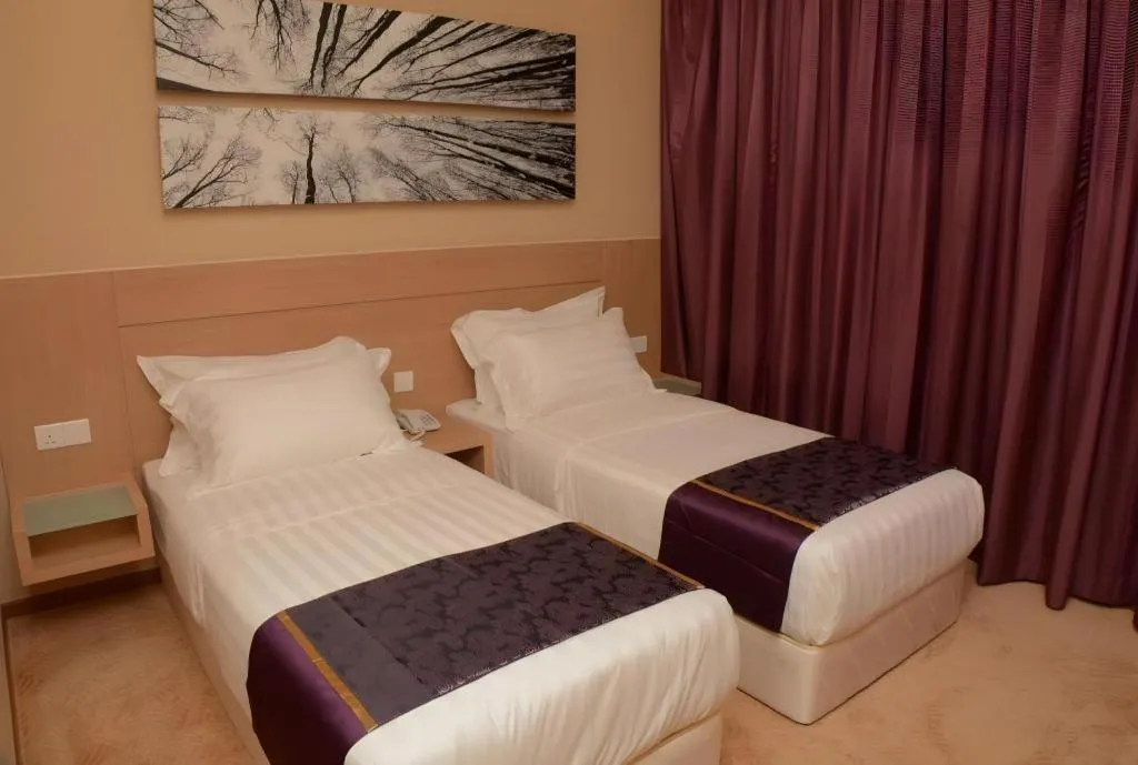 Bed in The Garden Boutique Hotel