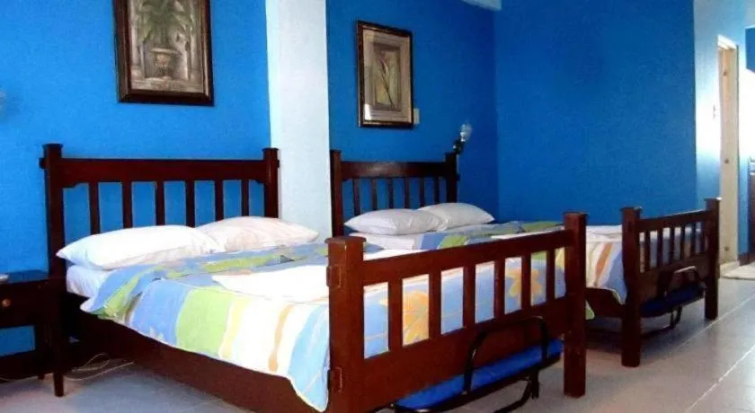 Bed in Tamaraw Beach Resort