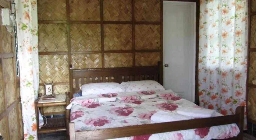 Bed in Sanctuary Garden Resort