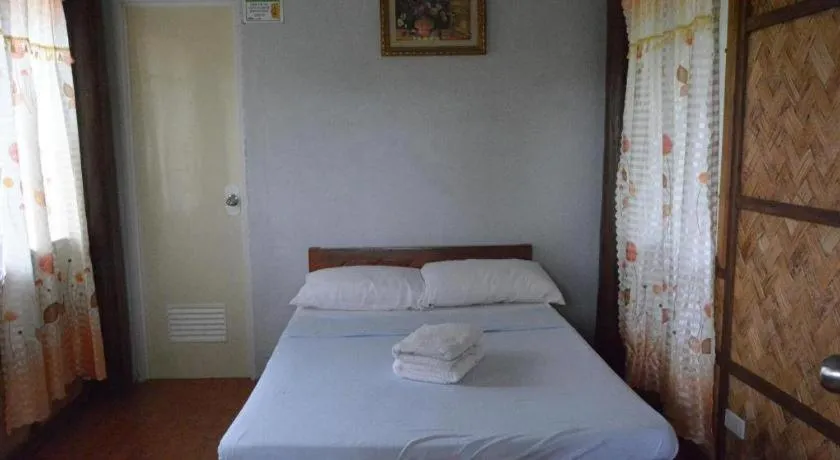 Bed in Sanctuary Garden Resort