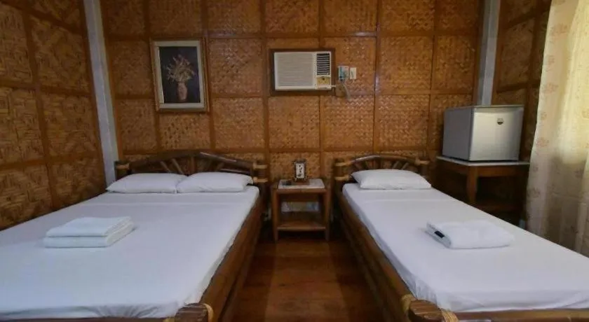 Bed in Sanctuary Garden Resort