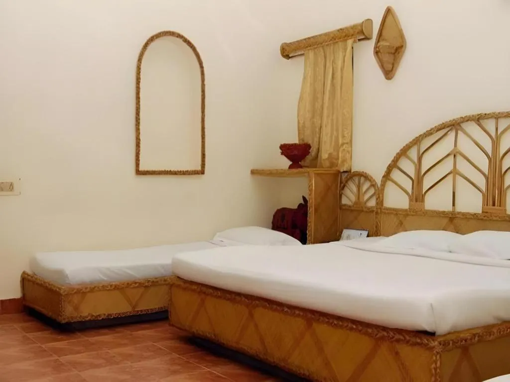 Bed in Pragati Green Meadows and Resort