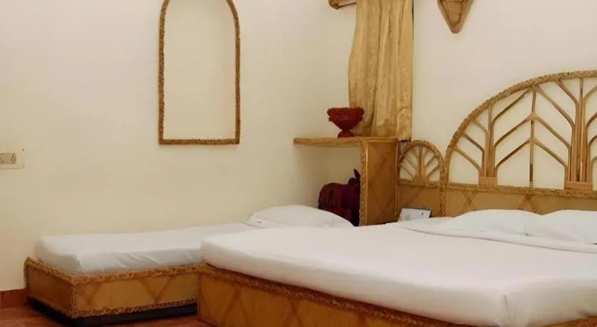 Bed in Pragati Green Meadows and Resort