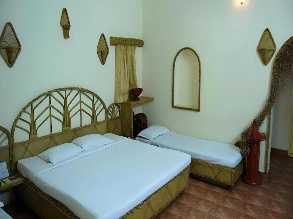 Bed in Pragati Green Meadows and Resort