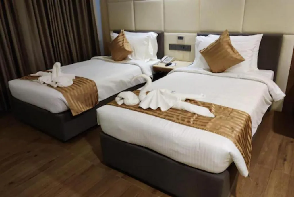 Bed in Hotel Minerva Grand