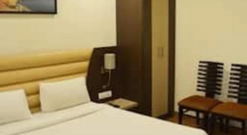 Bed in Hotel J.S. Residency