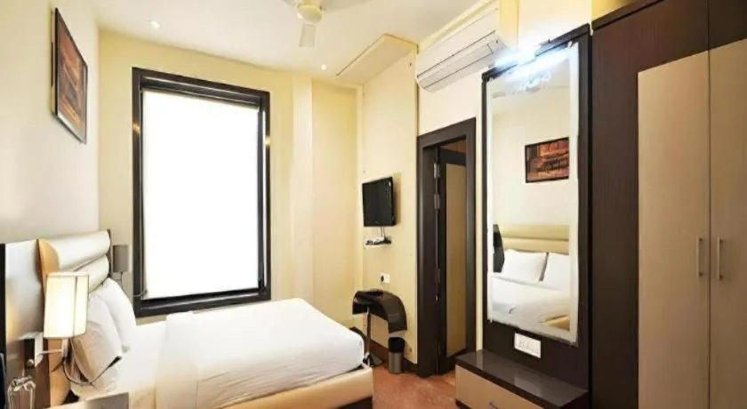 Bed in Hotel J.S. Residency