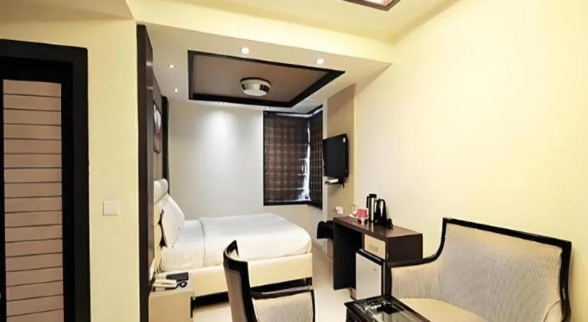 Bed in Hotel J.S. Residency