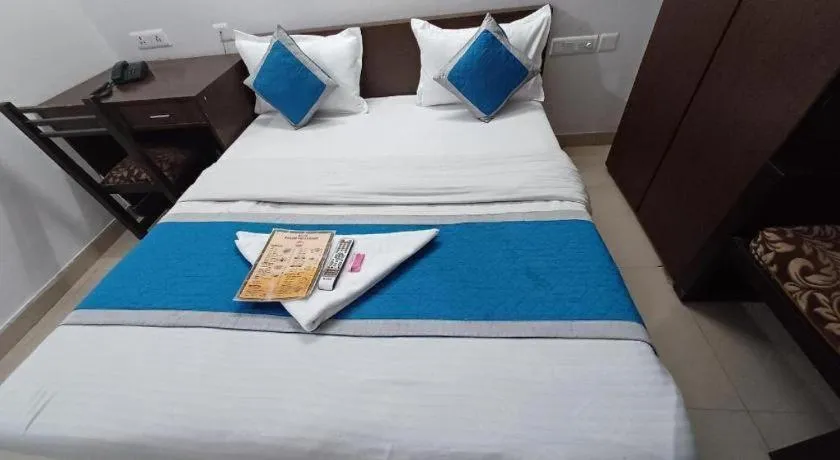 Bed in Hotel Laxmi Villa Palace