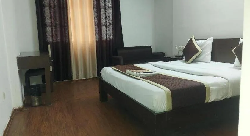 Bed in Hotel Laxmi Villa Palace