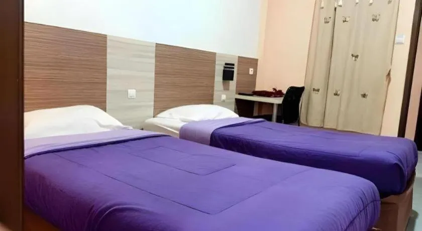 Bed in Urbanview Hotel Delima 101 Syariah