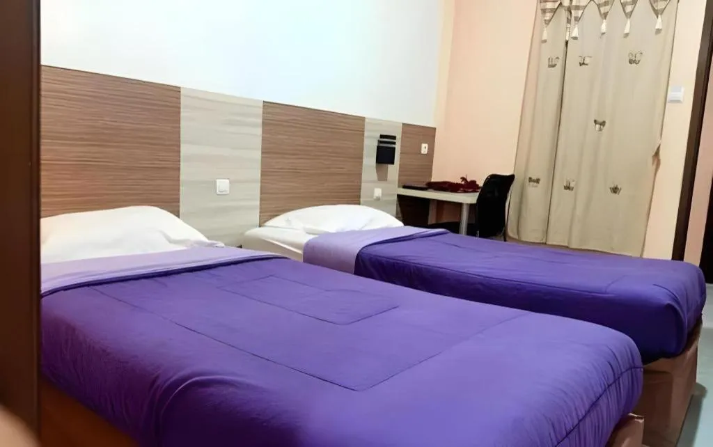 Bed in Urbanview Hotel Delima 101 Syariah