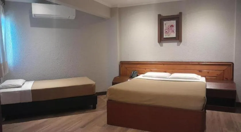 Bed in Baguio Palace Hotel