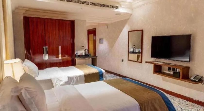 Bed in Gulf Pearls Hotel