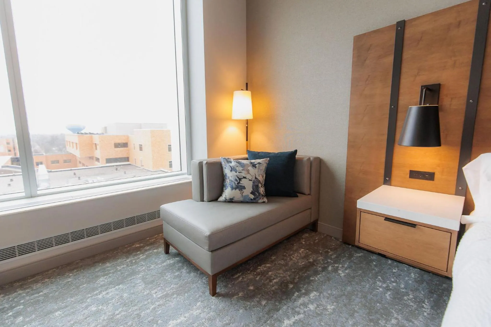 Seating area, Bed in Highpoint Hotel