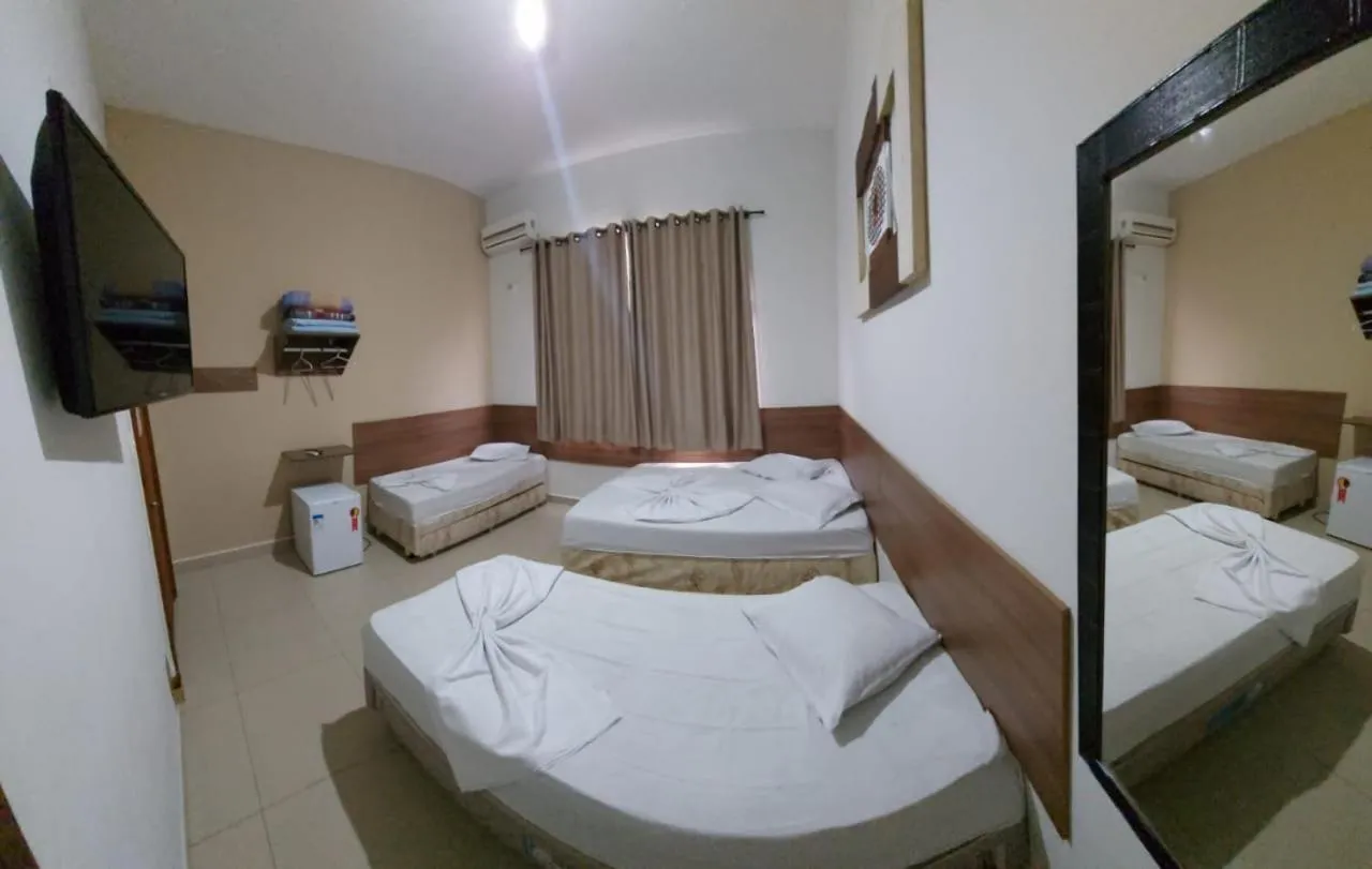 Bed in Pousada Santa Terezinha