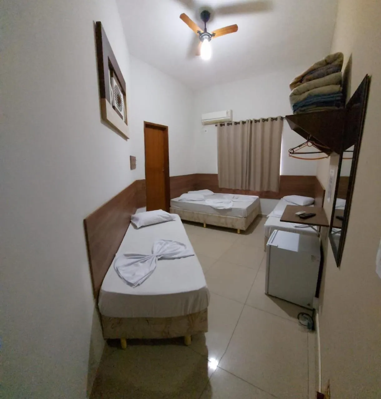 Bed in Pousada Santa Terezinha