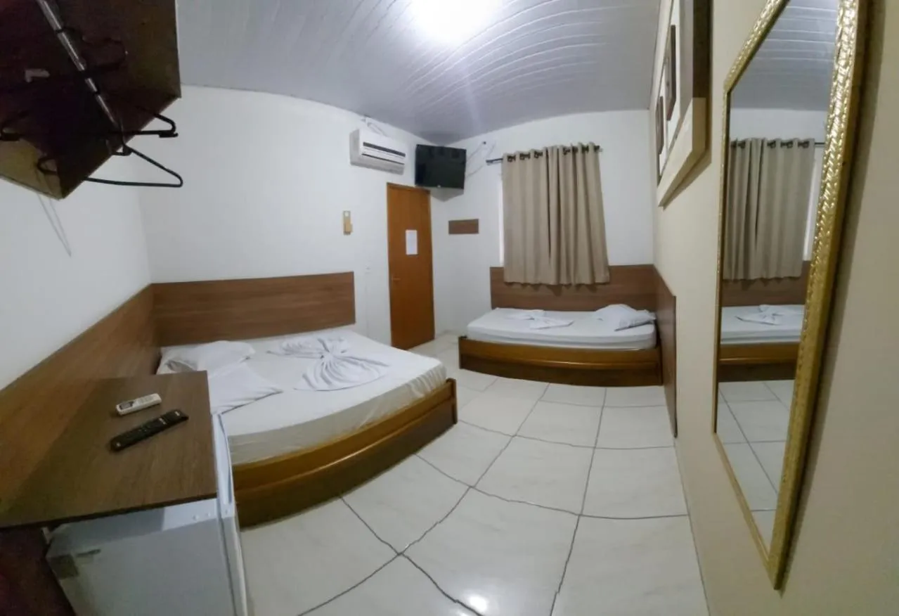 Bed in Pousada Santa Terezinha