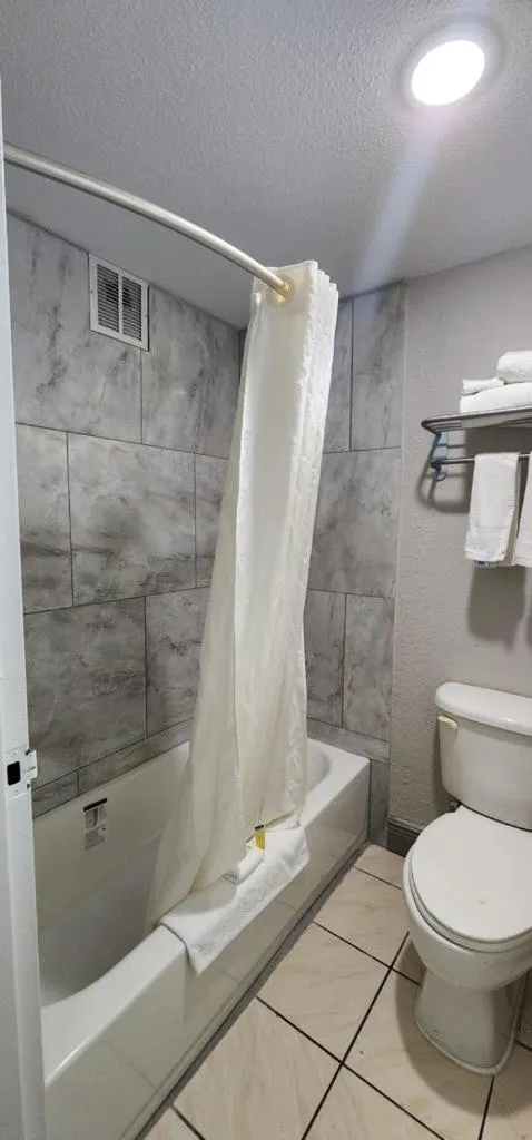 Toilet in Travelodge by Wyndham Kingsland GA