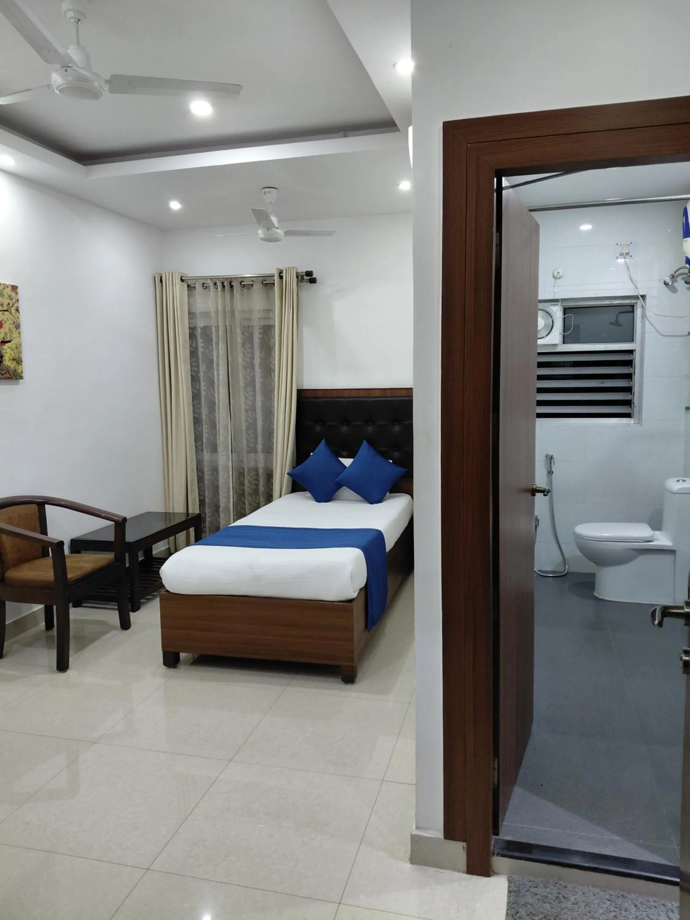 Toilet, Bed in Debadaru Guest House