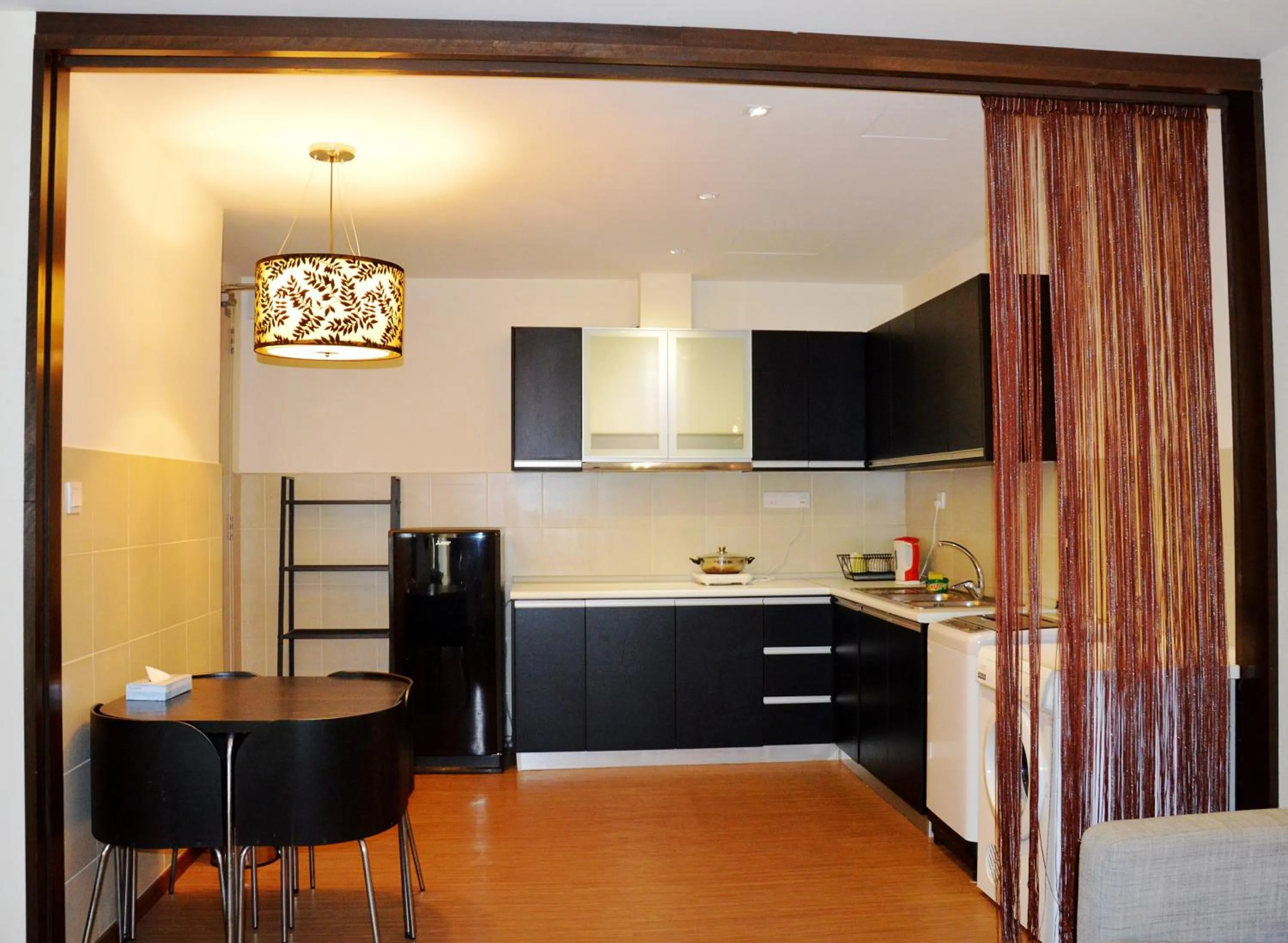 Kitchen or kitchenette in Taragon Residences