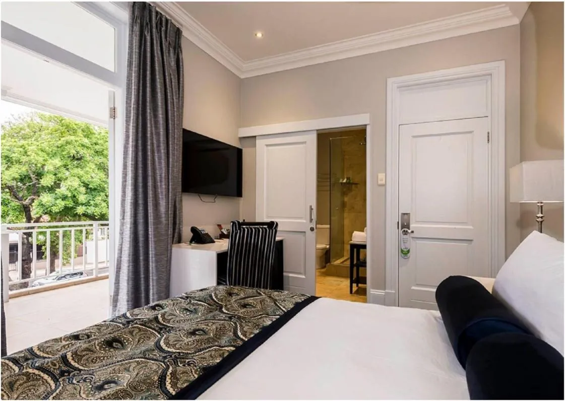 Bed in Luxe Avondale Boutique Hotel