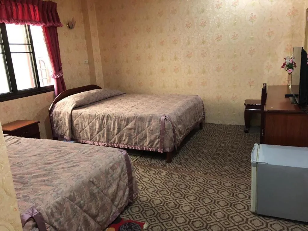 Bed in Thaveesinh Hotel