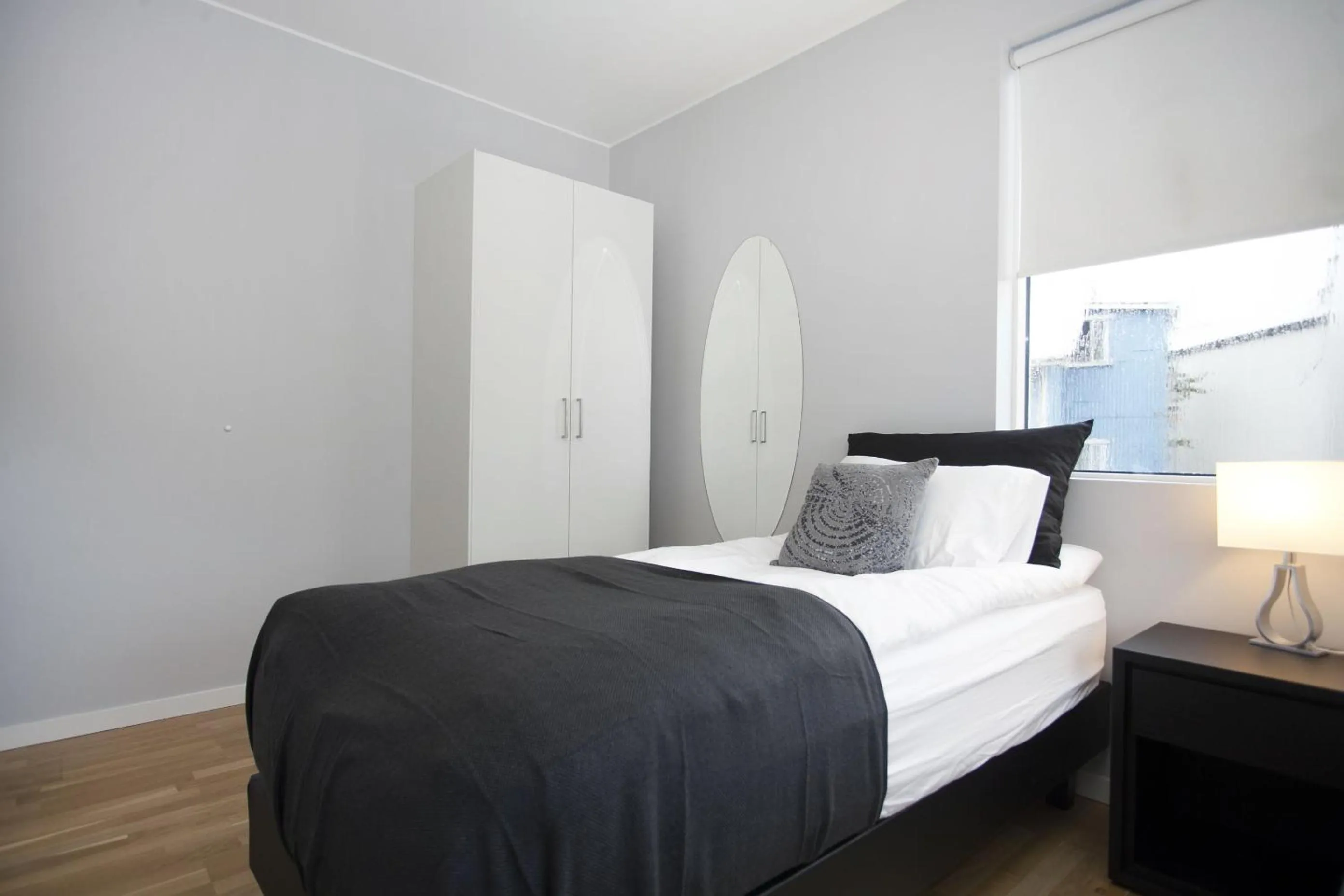 Bed in Blue Luxury Apartments