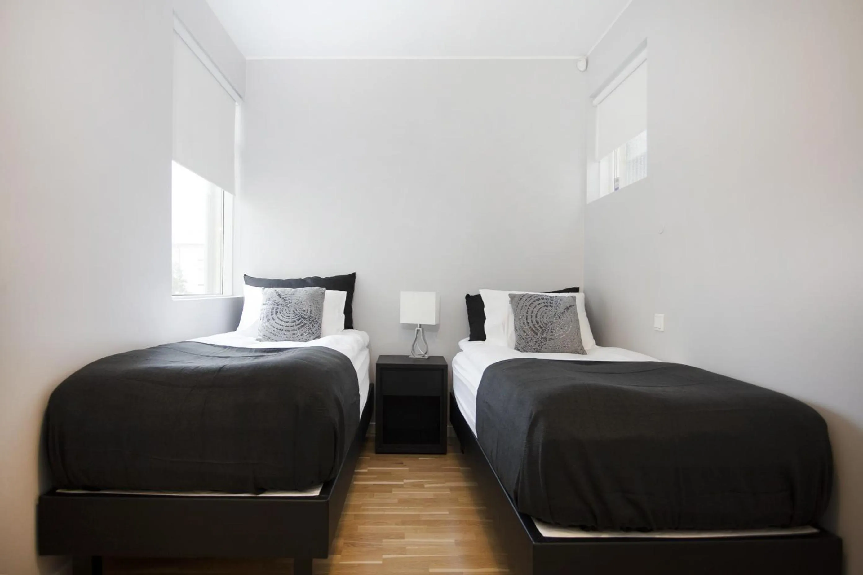 Bed in Blue Luxury Apartments