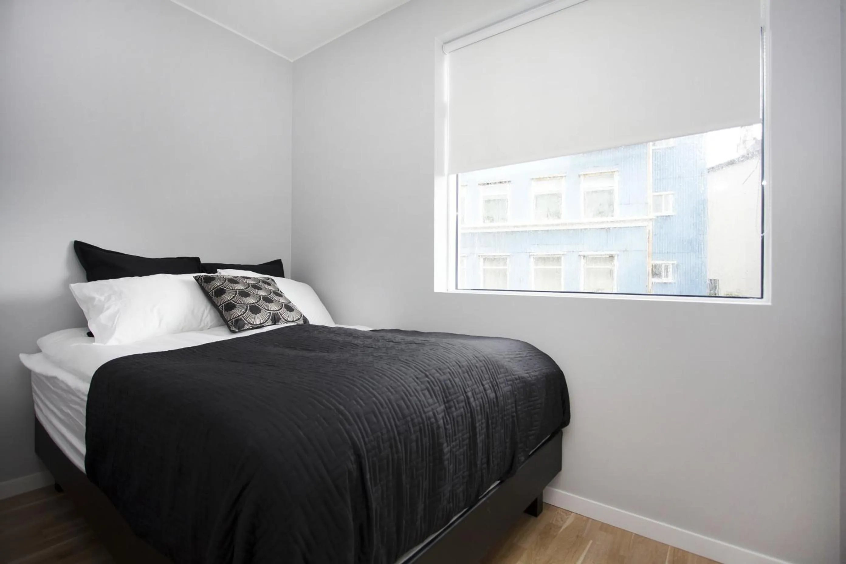 Bed in Blue Luxury Apartments