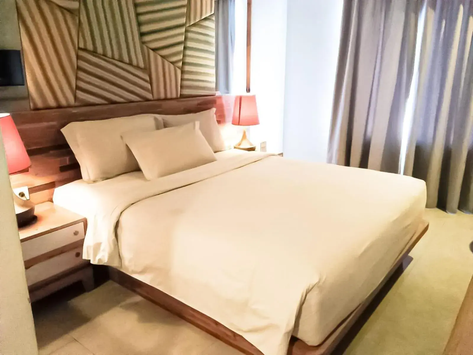 Bed in Serela Legian by KAGUM Hotels
