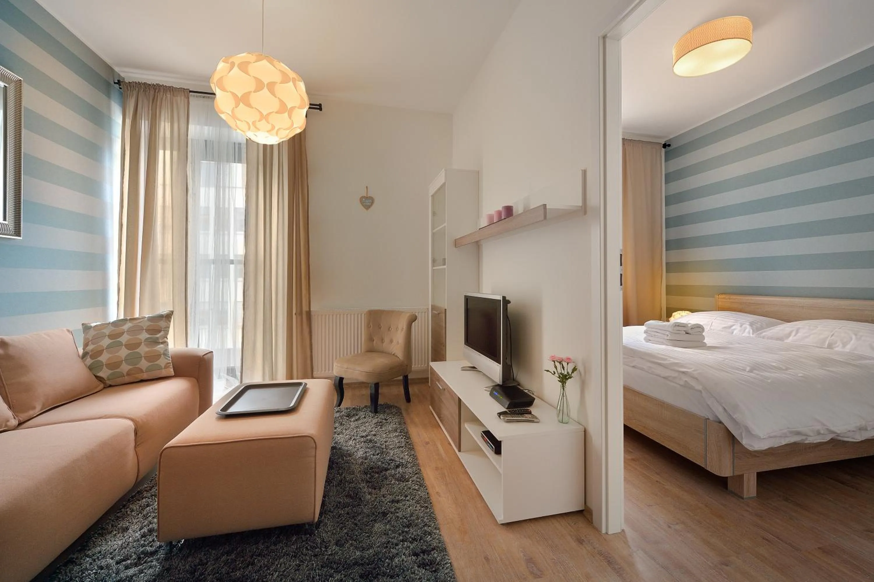 Living room, Bed in Charming & Cozy Ambiente Apartments