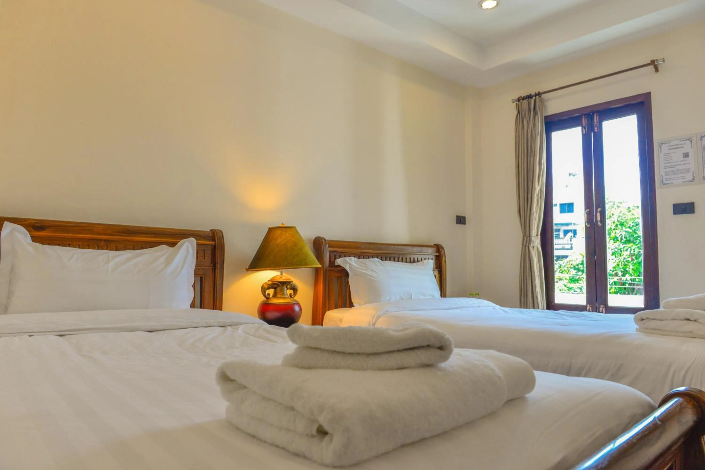 Bed in Yi's Garden Villa