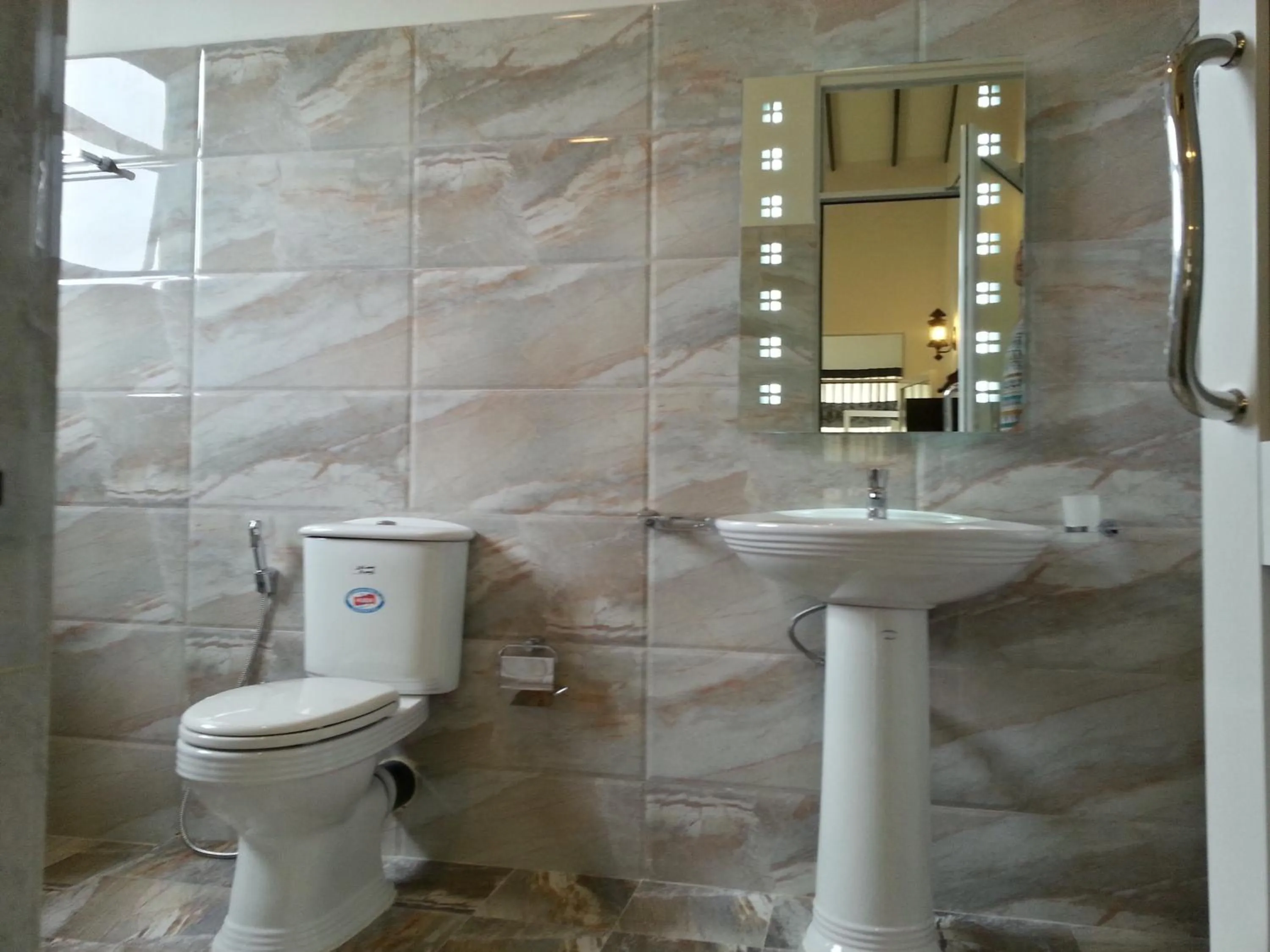 Bathroom in Coral Palm Villa and Apartment