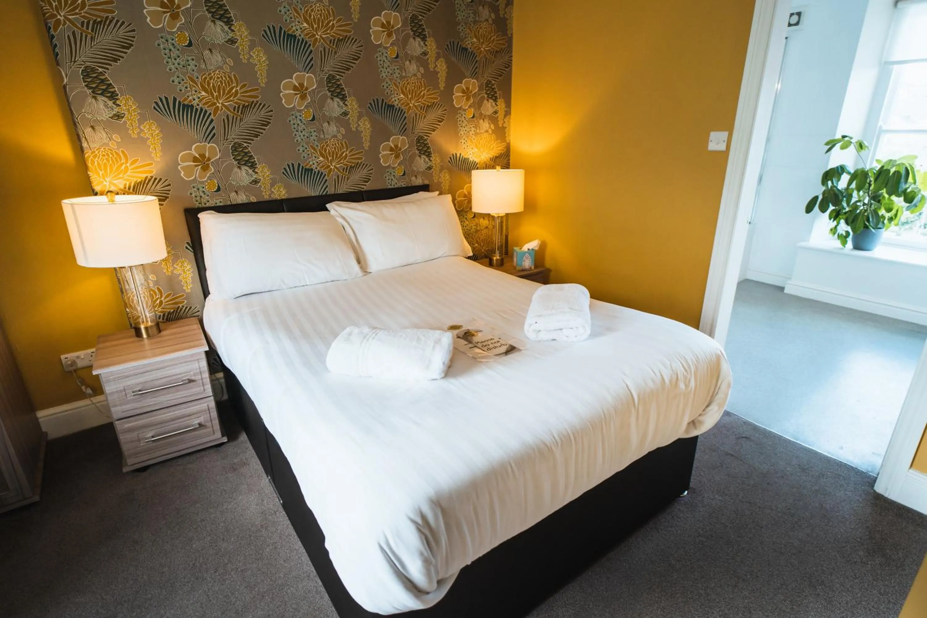 Bed in Johnny Dough's Conwy with Rooms