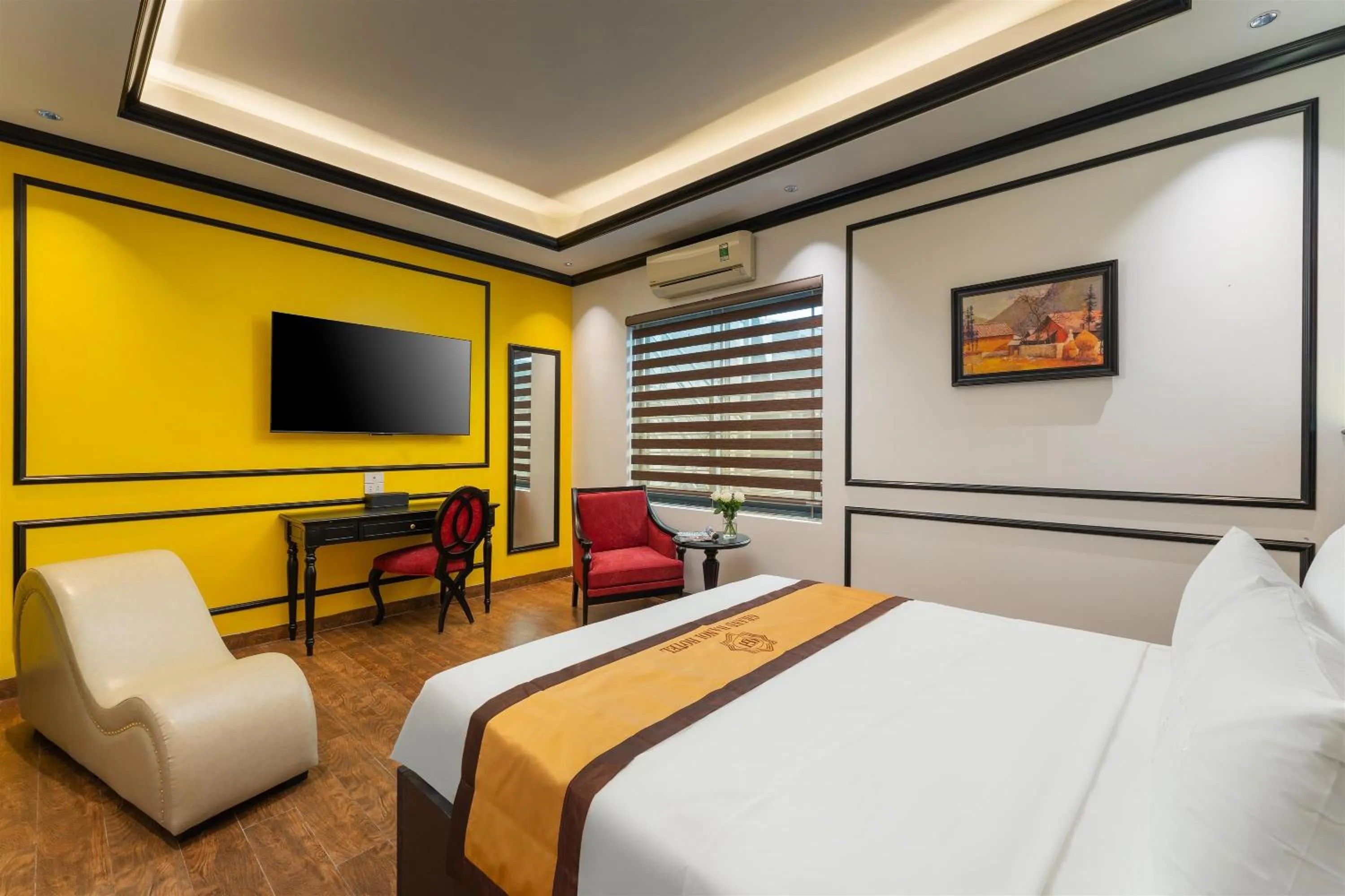 Communal lounge/ TV room, Bed in Grand Hanoi Boutique Hotel