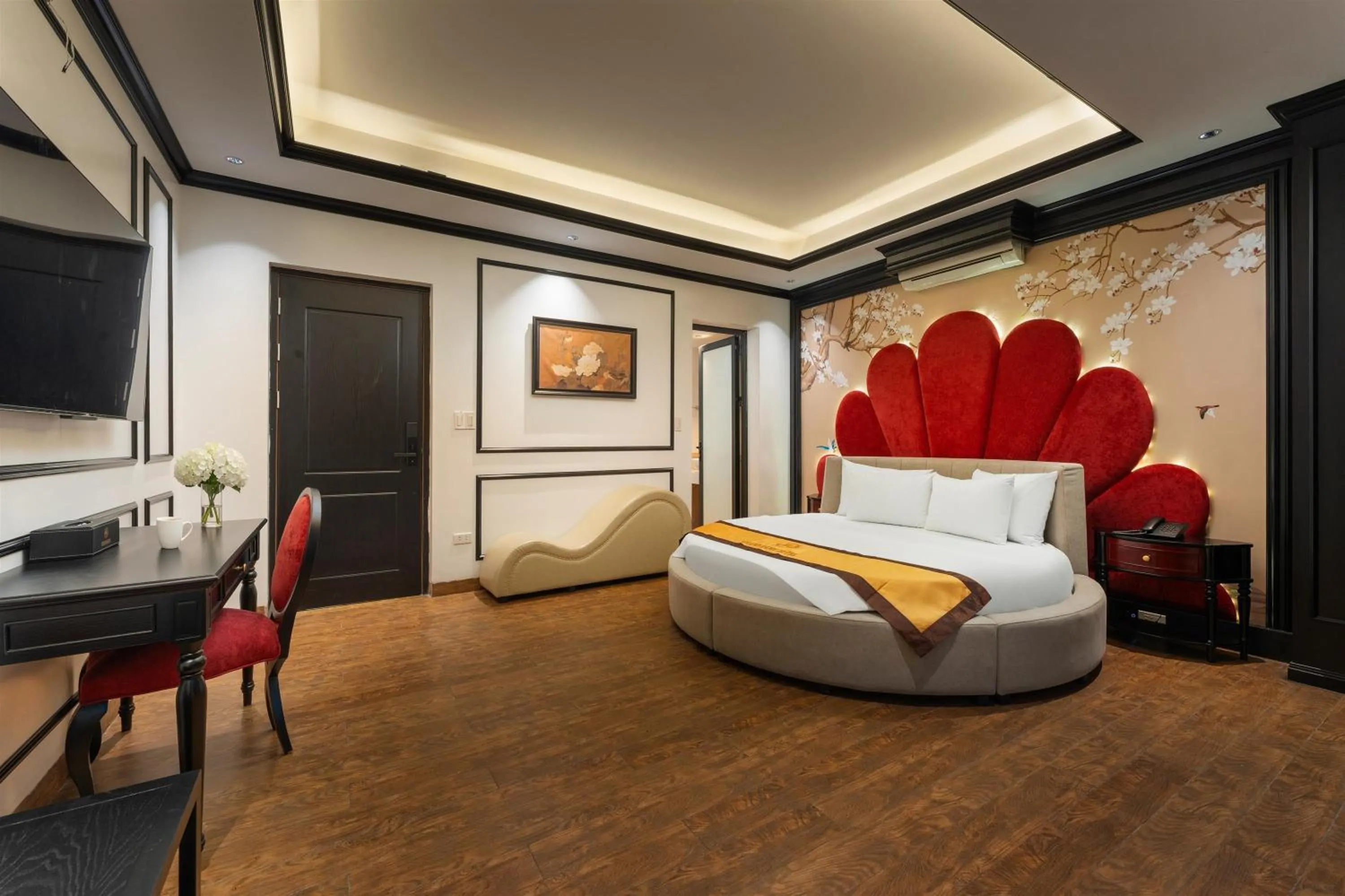 Communal lounge/ TV room, Bed in Grand Hanoi Boutique Hotel